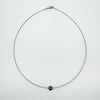 Contemporary 9ct white gold necklace with black pearl fixed in centre