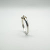 Rear view of sterling silver ring with twisted gold detail