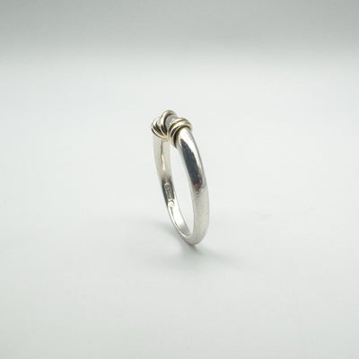 Rear view of sterling silver ring with twisted gold detail