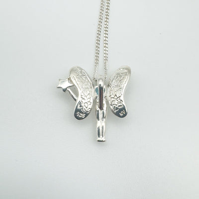 Sterling silver fairy pendant from the back showing textured wings and chain