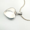 Reverse side of sterling silver heart pendant stamped 925 on the bail