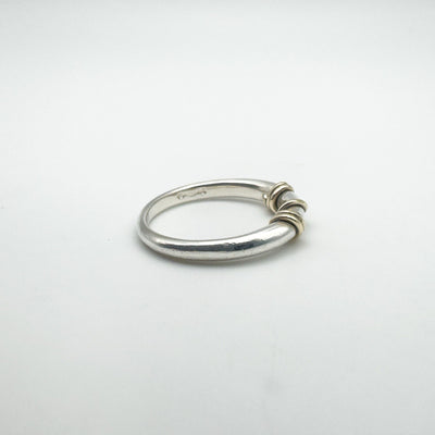 Sterling silver and gold ring with flat display showing gold twist