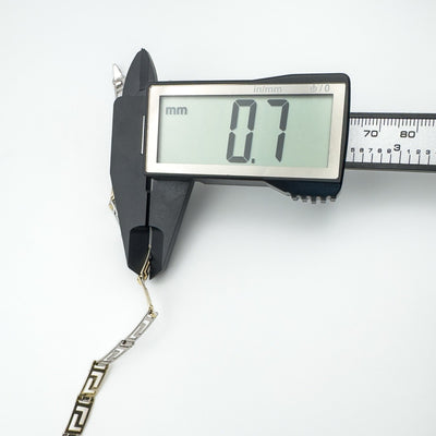 Caliper showing depth of bracelet link at 0.7mm