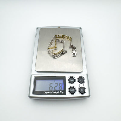 Greek Key bracelet weighing 6.28 grams on digital scale