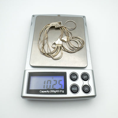 Multi strand sterling silver bracelet weighing 10.25g on digital scale