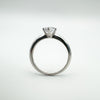 Side view of CZ solitaire ring in sterling silver with raised setting