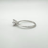 Angled view of sterling silver solitaire ring with CZ stone