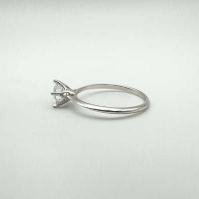 Angled view of sterling silver solitaire ring with CZ stone