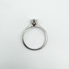 Sterling silver CZ solitaire ring laid flat showing full circle band