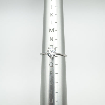 Size O sterling silver CZ solitaire ring on ring sizer