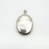 Large sterling silver locket with foliate engraving