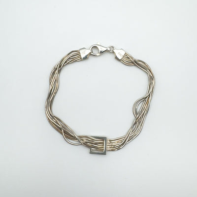 Sterling silver snake box chain bracelet laid flat with square centre