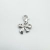 Front view of diamond set bow pendant in sterling silver
