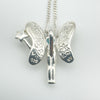 Back of sterling silver fairy pendant showing 925 stamp and wing detailing