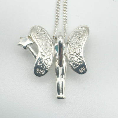 Back of sterling silver fairy pendant showing 925 stamp and wing detailing