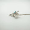 Side profile of fairy pendant showing Blue Topaz and CZ setting depth