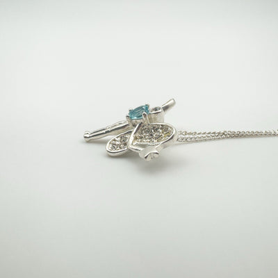 Side profile of fairy pendant showing Blue Topaz and CZ setting depth