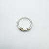 Full flat lay of twisted gold and sterling silver ring size L