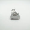 Flat-lay of sterling silver heart charm with lobster clasp