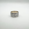 Wide sterling silver ring with engraved leaf design, front view