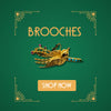 Gold bird brooch with turquoise and multicoloured stones on green background with art deco corners and Shop Now button