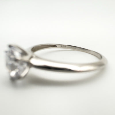 Sterling silver band stamped 925 with solitaire setting