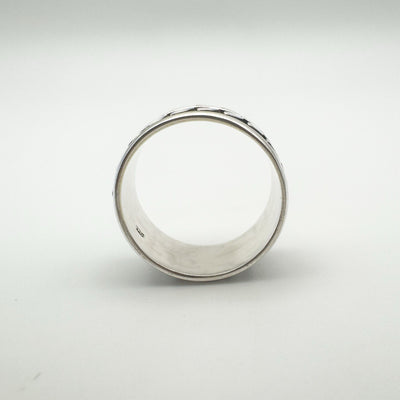  Interior of wide sterling silver ring showing curved band and hallmark