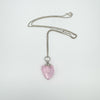 Pink heart-shaped perfume bottle pendant on silver chain