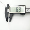 Digital caliper showing black pearl pendant measures 6.9mm diameter