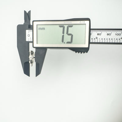 Depth measurement of sterling silver fairy pendant at 7.5mm