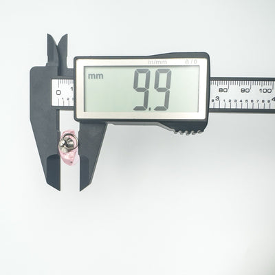Pendant depth measured at 9.9mm with digital caliper