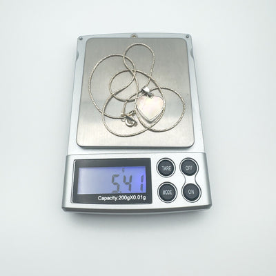 Weighing sterling silver pink Mother of Pearl necklace at 5.4 grams