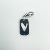 Reverse of sterling silver heart charm showing heart cut-out shape