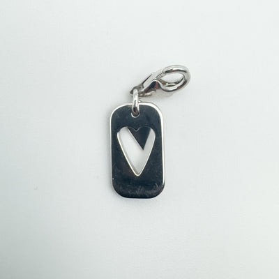 Reverse of sterling silver heart charm showing heart cut-out shape