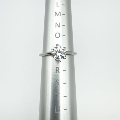 CZ solitaire ring displayed on ring sizer showing UK size P