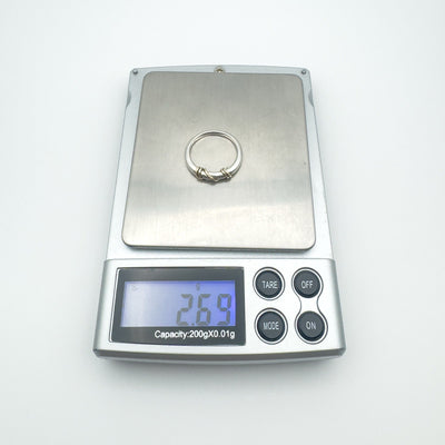 Twisted ring on jewellery scale showing 2.69g weight