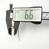 Digital caliper measuring a round cubic zirconia stone at 6.6mm