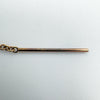 Close-up of hallmark "1/20 14K" on rose gold threader earring post