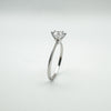 Side angle showing slim sterling silver band and prong setting