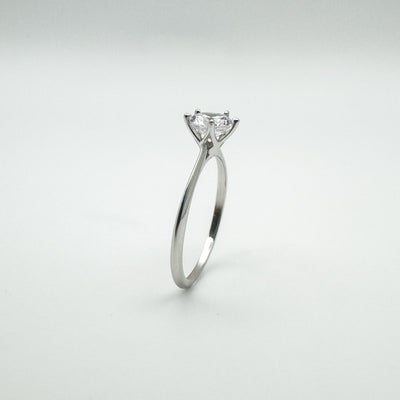 Side angle showing slim sterling silver band and prong setting