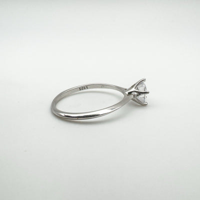Sterling silver solitaire ring showing CZ and 925 hallmark on inner band