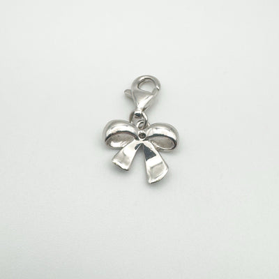 Rear view of bow pendant showing polished silver finish
