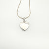Back of sterling silver heart-shaped pendant on matching silver chain