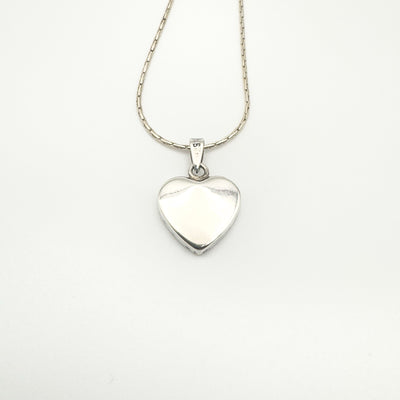 Back of sterling silver heart-shaped pendant on matching silver chain