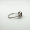 Side view of ring showing open gallery design beneath Smokey Quartz stones