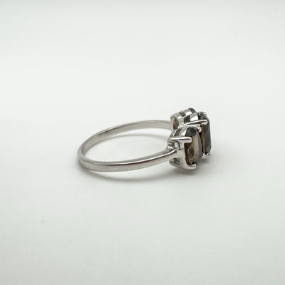 Side view of ring showing open gallery design beneath Smokey Quartz stones
