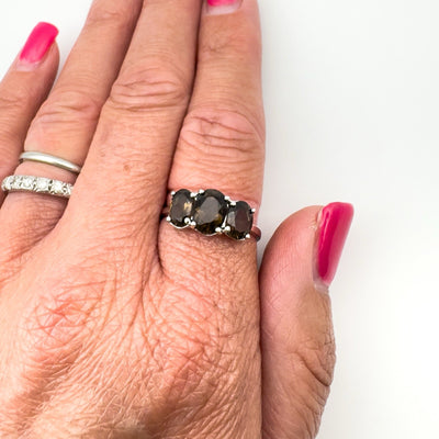 Smokey Quartz trilogy ring worn on finger