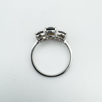 Top view of Smokey Quartz trilogy ring showing gemstone alignment and silver band