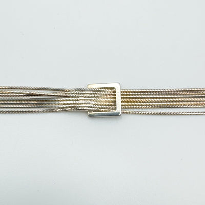 Close-up of square buckle on sterling silver snake chain bracelet
