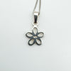 Reverse of sterling silver flower pendant stamped 925.